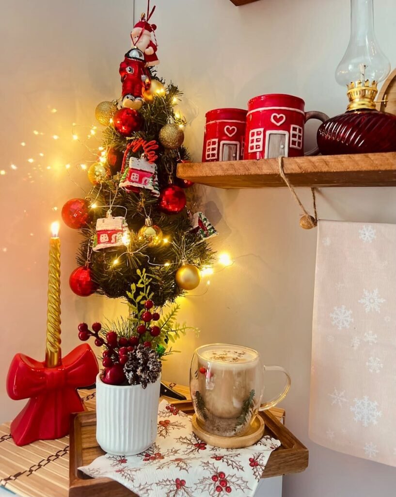 A warm, festive corner with a mini Christmas tree and seasonal decorations.