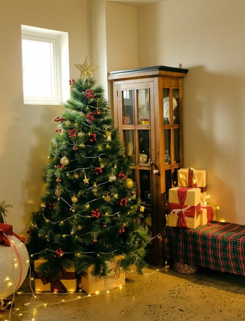 A decorated christmas tree with presents and lights.